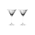To fasettslipte krystallcocktailglass i gråtoner med tidløst, skandinavisk design fra Frederik Bagger