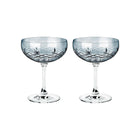 To fasettslipte champagneskåler i blått farget krystallglass fra Frederik Bagger, diamantmønster detalj.