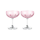 To rosa champagneglass i krystall med diamantmønster fra Frederik Bagger, skandinavisk design