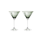 To grønne fasettslipte krystallcocktailglass i skandinavisk design fra Frederik Bagger.