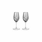 To fasettslipte portvinsglass i klart røykfarget glass med skandinavisk design fra Frederik Bagger.